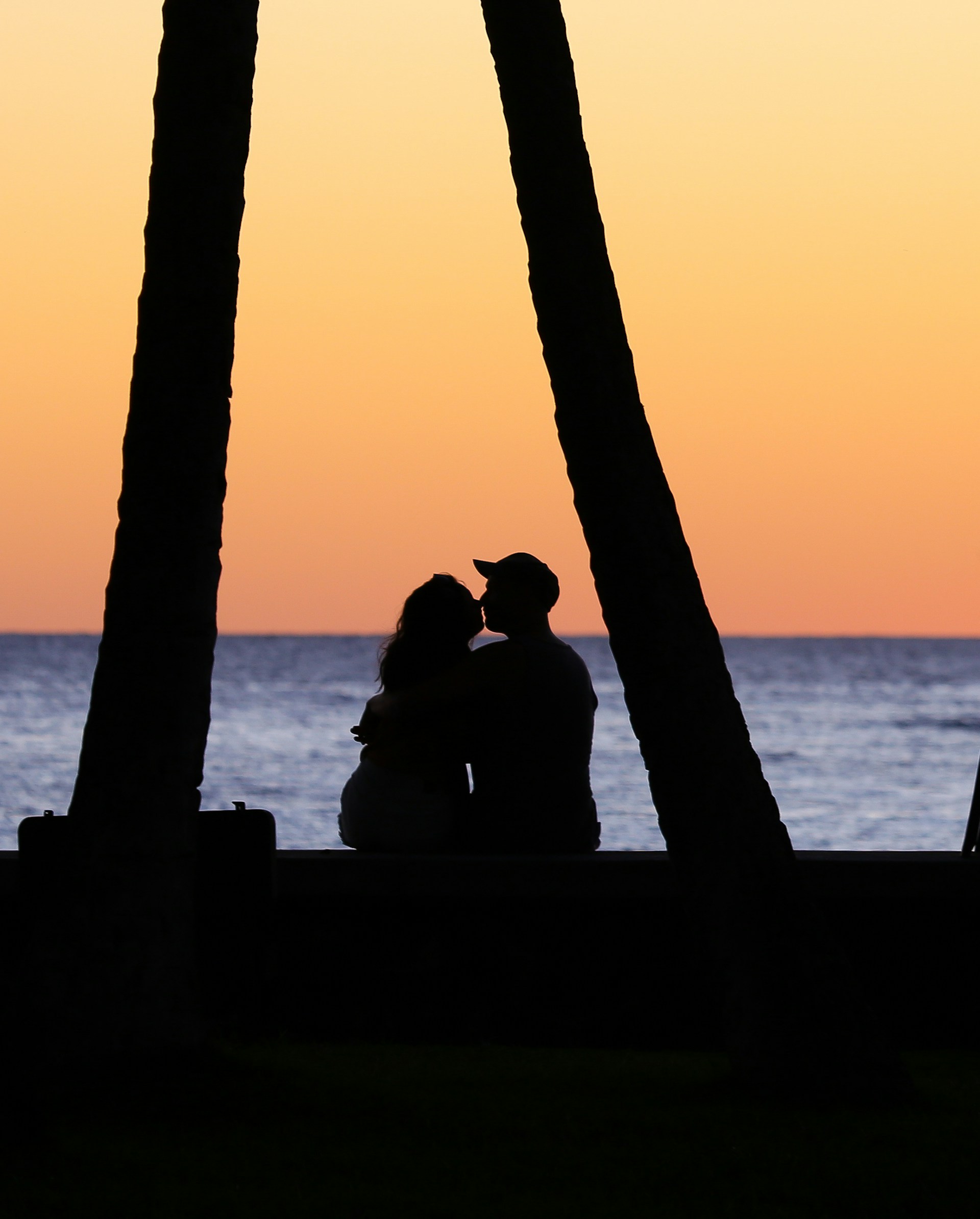 Romantic Couple kissing by the beach